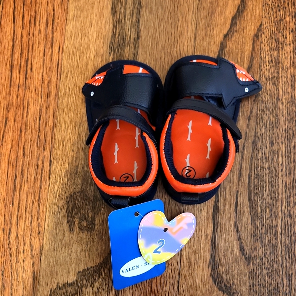 Pair of infant boy shark sandals
